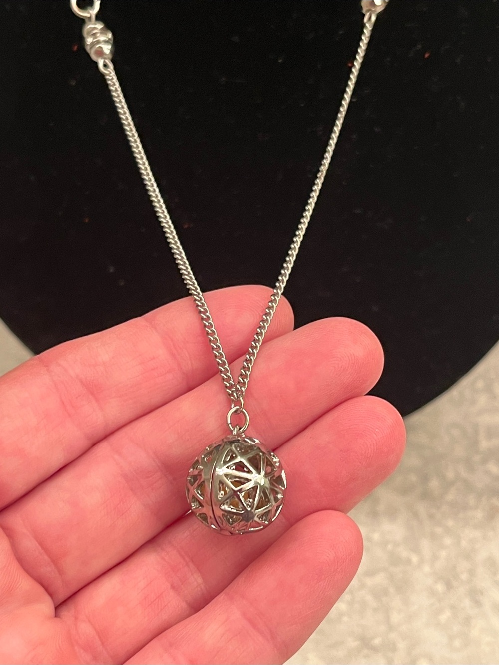 Silver toned round locket holds essential oil balls inside with Necklace 28 in.